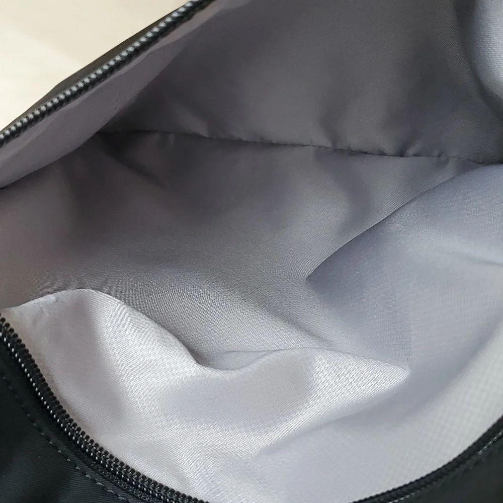 NWOT Tumi Just in Case Backpack in Black and Gold